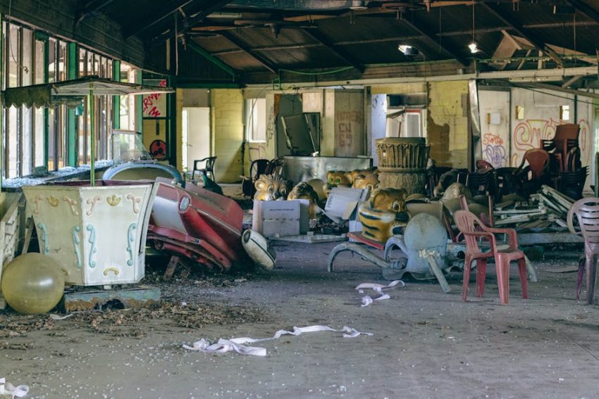 A rusted carousel horse at George Lund's Universal Park, its painted eyes still bright against decay.