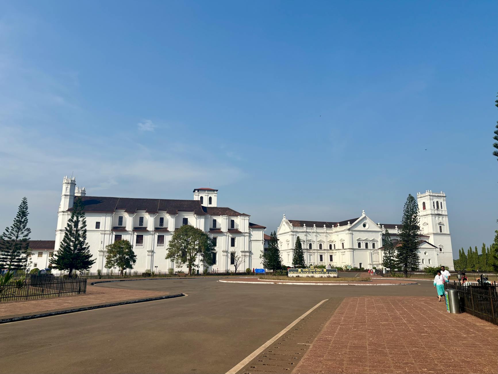 Beautiful view of Se Cathedral, a historic landmark in Old Goa, under a bright blue sky.