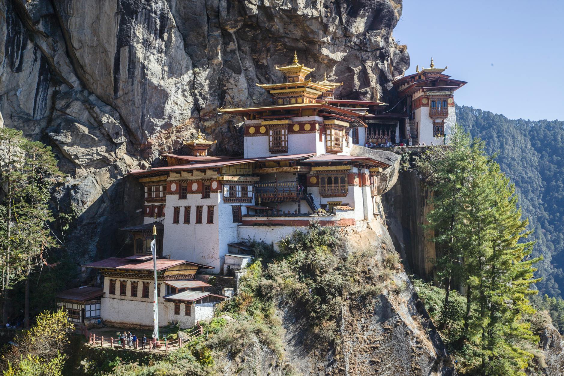 Stunning view of Tiger's Nest Monastery perched on a cliff in Bhutan's mountains.