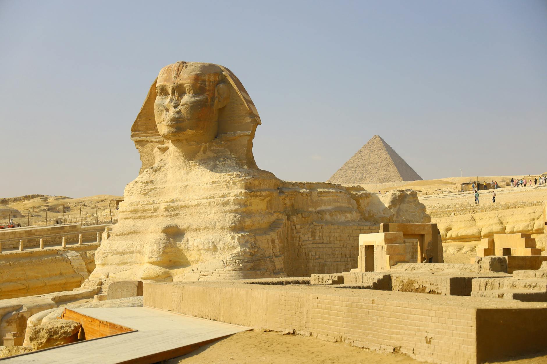 The iconic Great Sphinx and Pyramid of Giza captured on a sunny day.