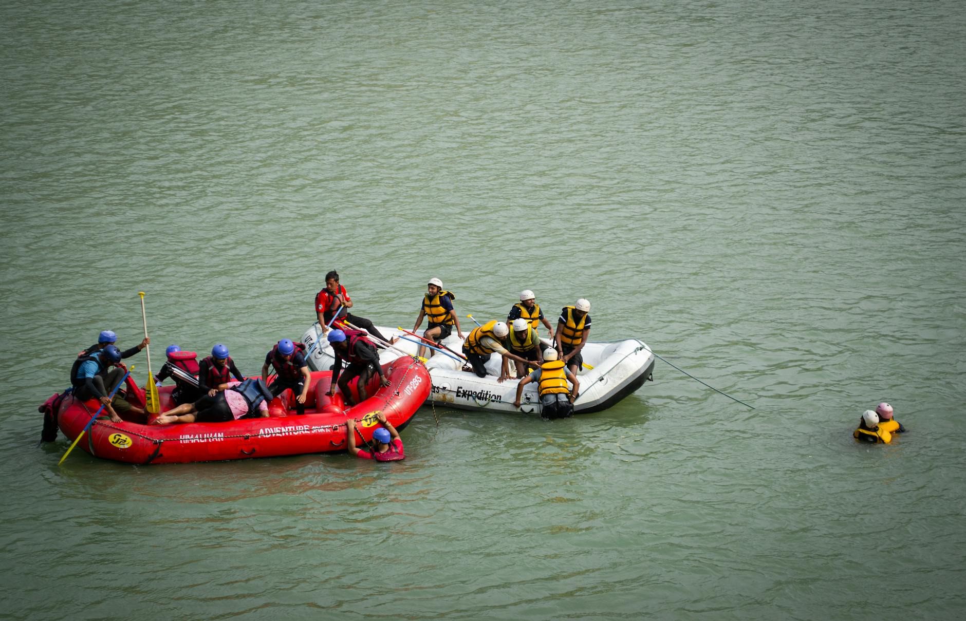 Group rafting on Ganges River in Rishikesh, India showcasing teamwork in action.