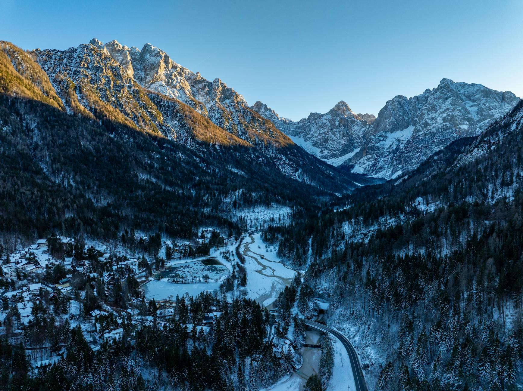 Stunning aerial view of snow-covered Kranjska Gora mountains during winter.
