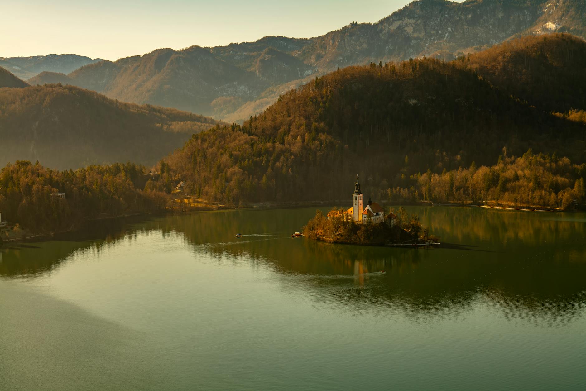 A serene view of Lake Bled in Slovenia with its picturesque church on an island.